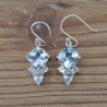 Petites boucles en argent et 4 pierres facettées en Topaze bleue (bleu)