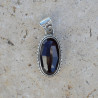 Pendentif ovale en argent ciselé et pierre Grenat